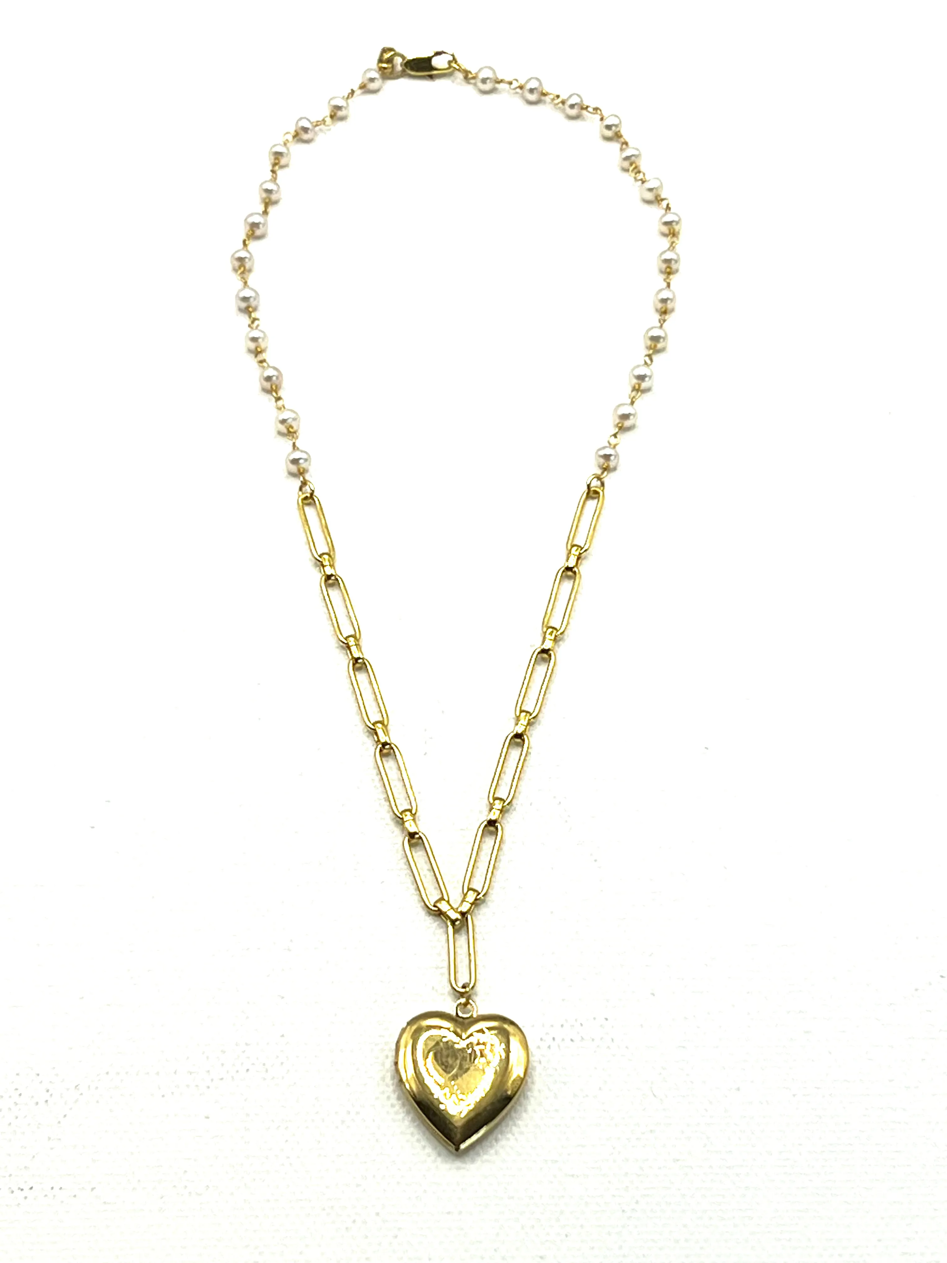 The Heart Locket Necklace sold by Vanessa Mooney