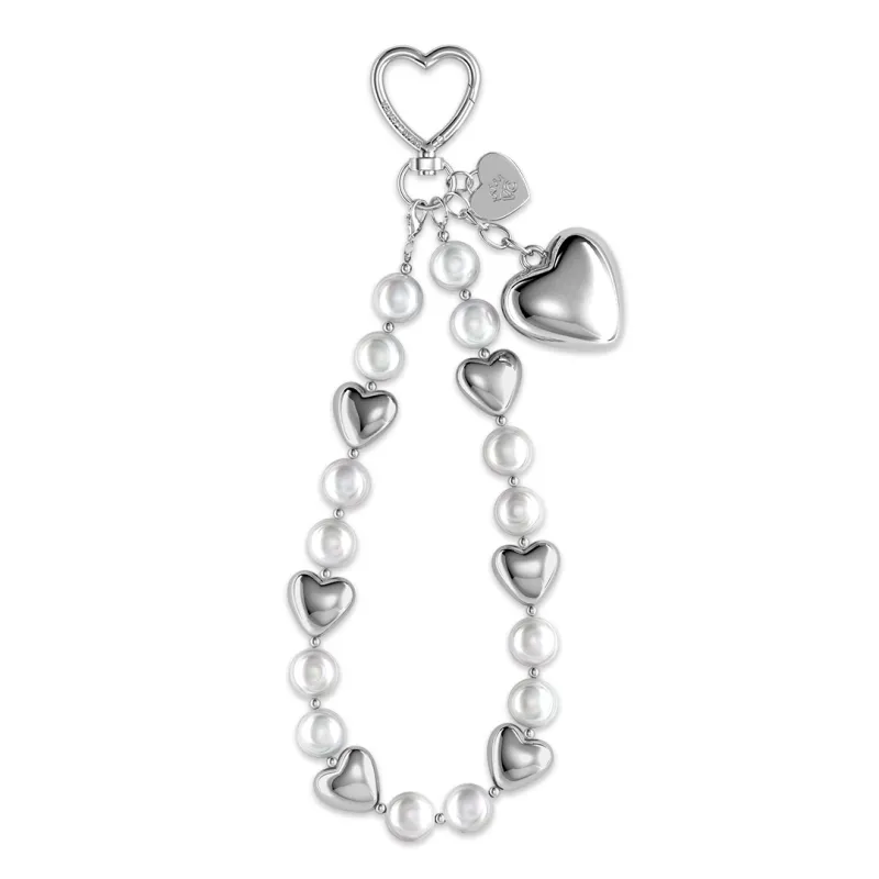 Silver Heart Drip Bag Charm sold by Velvet Caviar