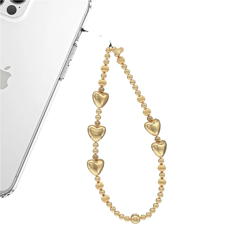 Gold Metallic Heart Phone Charm sold by Velvet Caviar