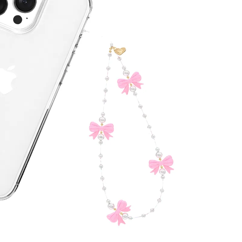 Pink Bow Phone Charm sold by Velvet Caviar