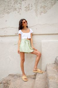 Cariño Linen Mini Skirt Sage sold by Verge Girl