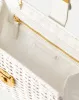Crest Lock Basket Clutch sold by Veronica Beard