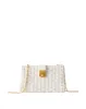 Crest Lock Basket Clutch sold by Veronica Beard