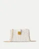 Crest Lock Basket Clutch sold by Veronica Beard