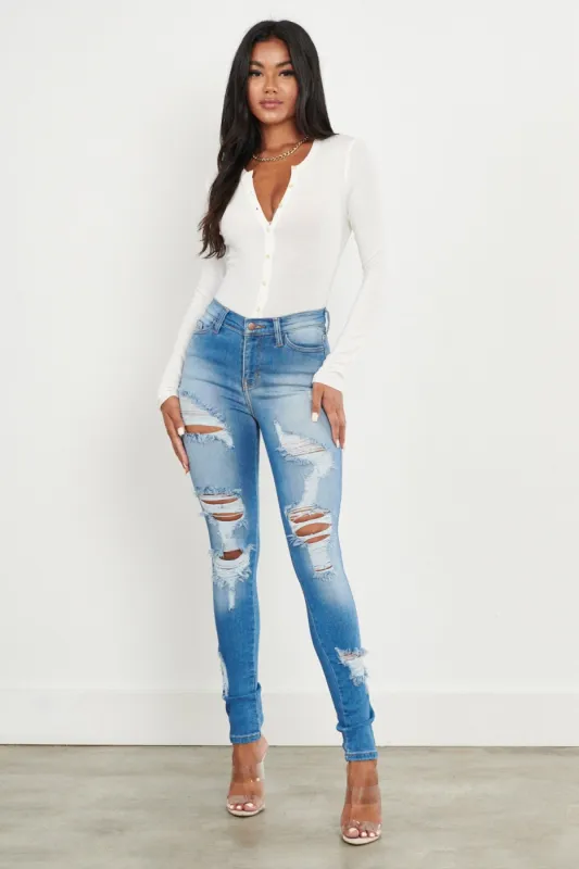 Cozy Vibrant Skinny Jeans with Distress sold by Vibrant