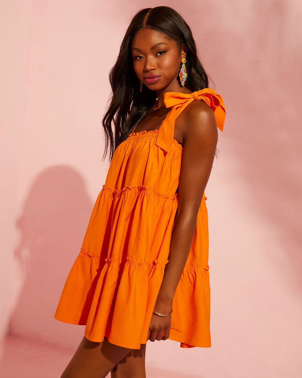Sansa Shoulder Tie Tiered Mini Dress sold by Vici