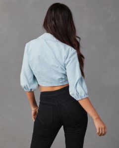 Netty Denim Wrap Top sold by Vici