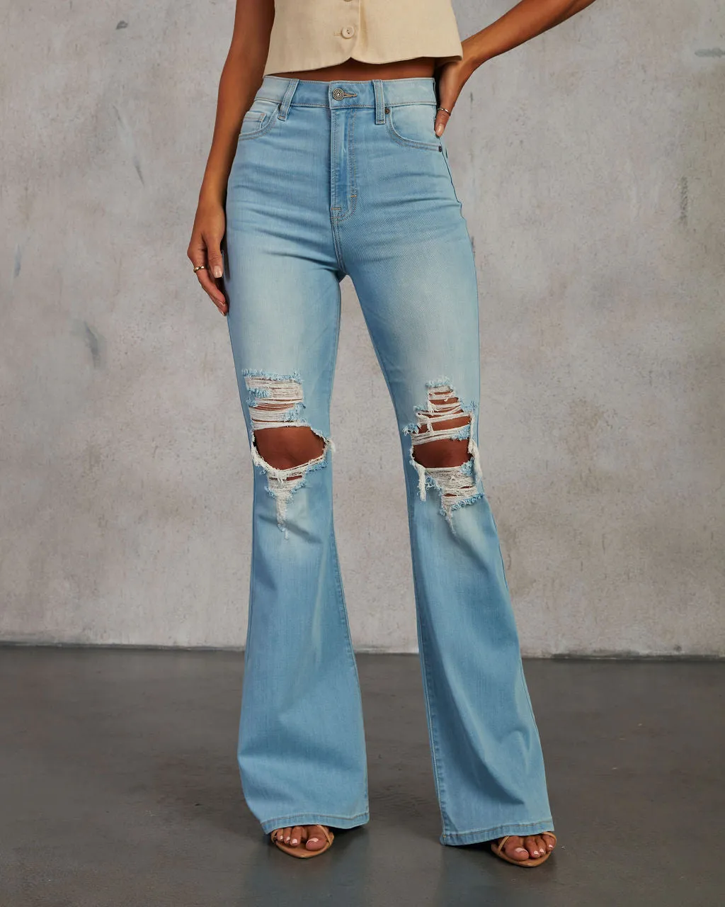 Bradly High Waisted Distressed Flare Denim Pants sold by Vici
