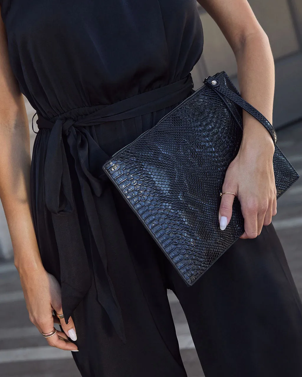 In My Skin Textured Zip Clutch sold by Vici