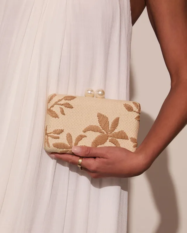 Voyage On Woven Straw Clutch sold by Vici