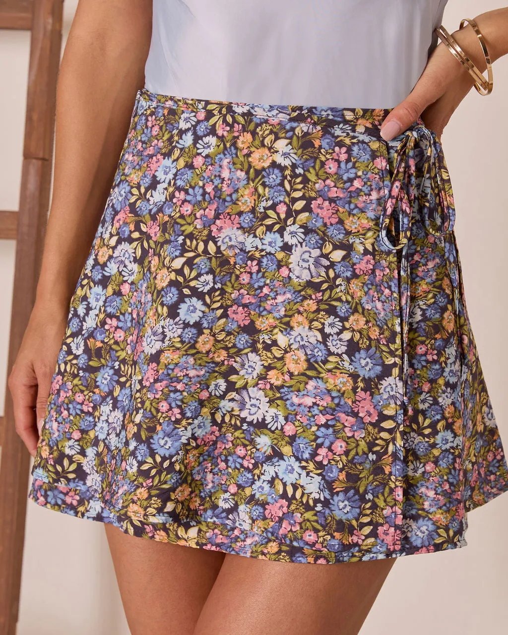 Willow Bloom Floral Wrap Mini Skirt sold by Vici