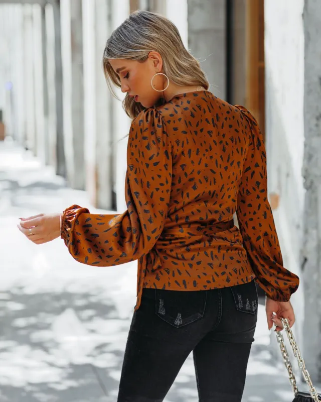In Awe Satin Printed Wrap Blouse sold by Vici