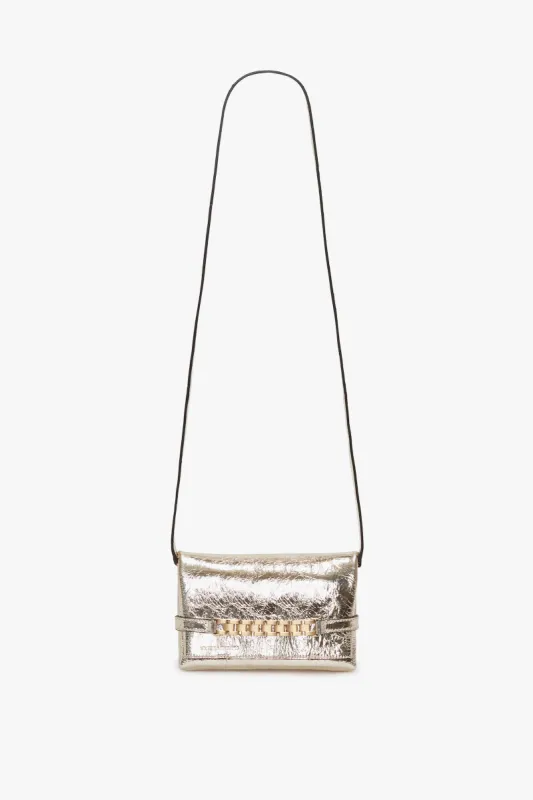 Mini Chain Pouch With Long Strap In Gold Leather sold by Victoria Beckham