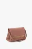 Chain Pouch Bag With Strap In Truffle Leather sold by Victoria Beckham