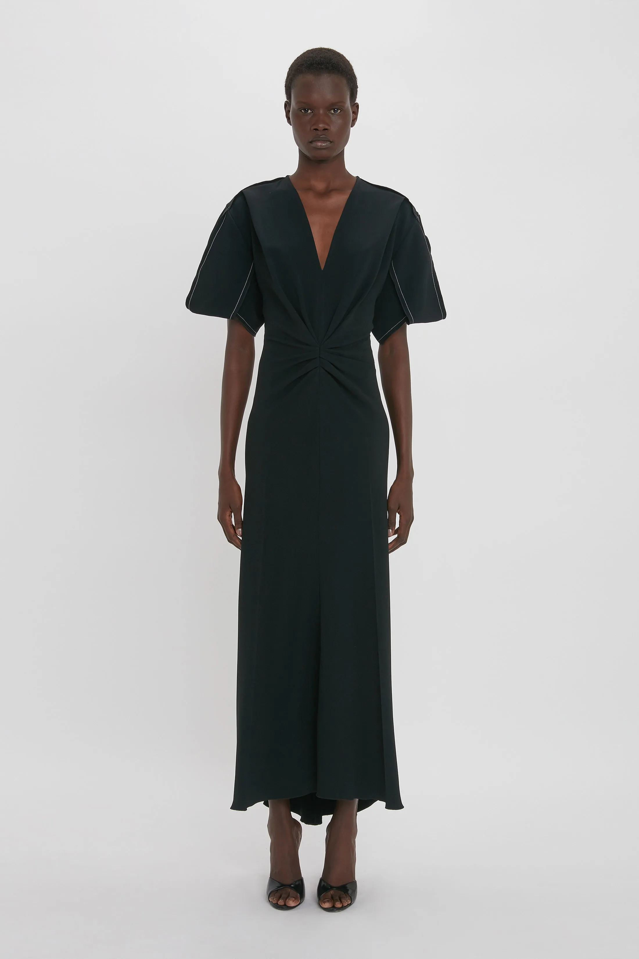 Gathered V-Neck Midi Dress in Black sold by Victoria Beckham