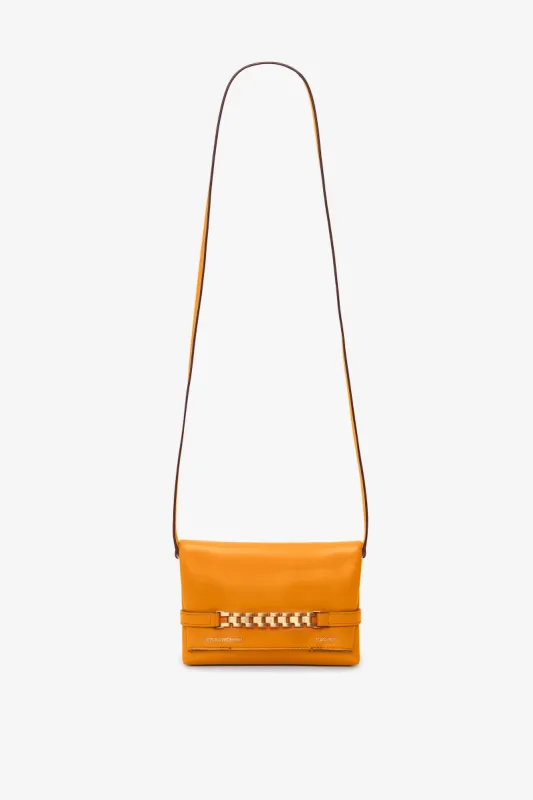 Mini Chain Pouch Bag With Long Strap In Mandarin Leather sold by Victoria Beckham