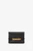 Mini Chain Pouch Bag With Long Strap In Black Leather sold by Victoria Beckham