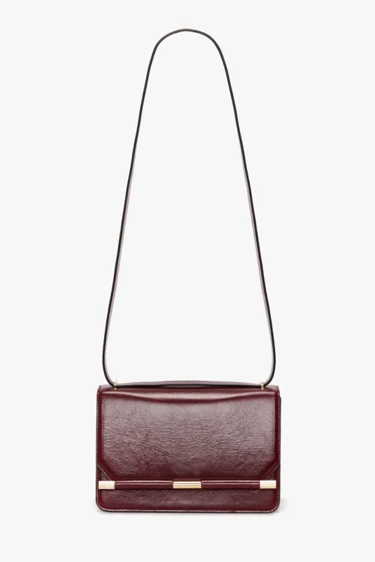 202 Crossbody Bag In Burgundy Distressed Leather sold by Victoria Beckham
