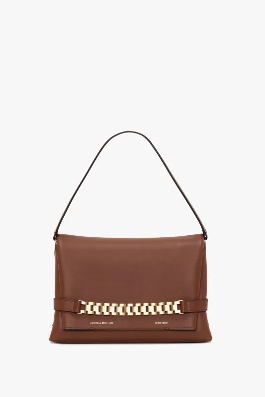 Chain Pouch Bag With Strap In Russet Leather sold by Victoria Beckham