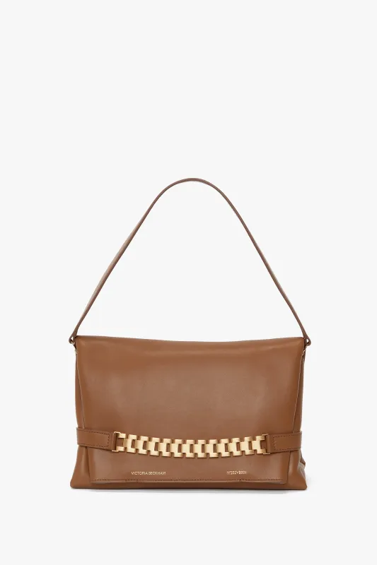 Chain Pouch Bag With Strap In Tobacco Leather made by Victoria Beckham