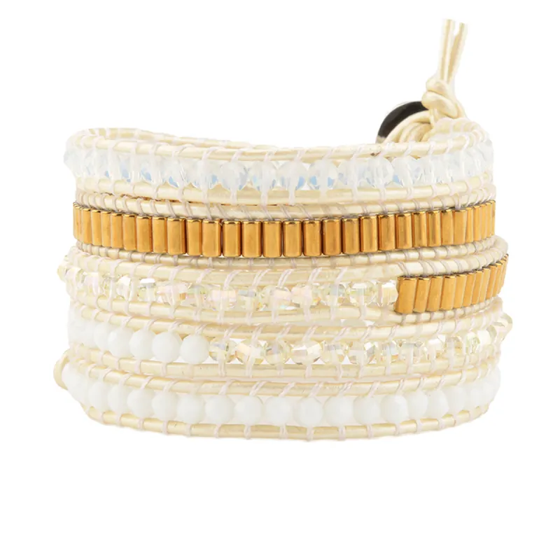 Crystals with Long Gold Beads on White sold by Victoria Emerson