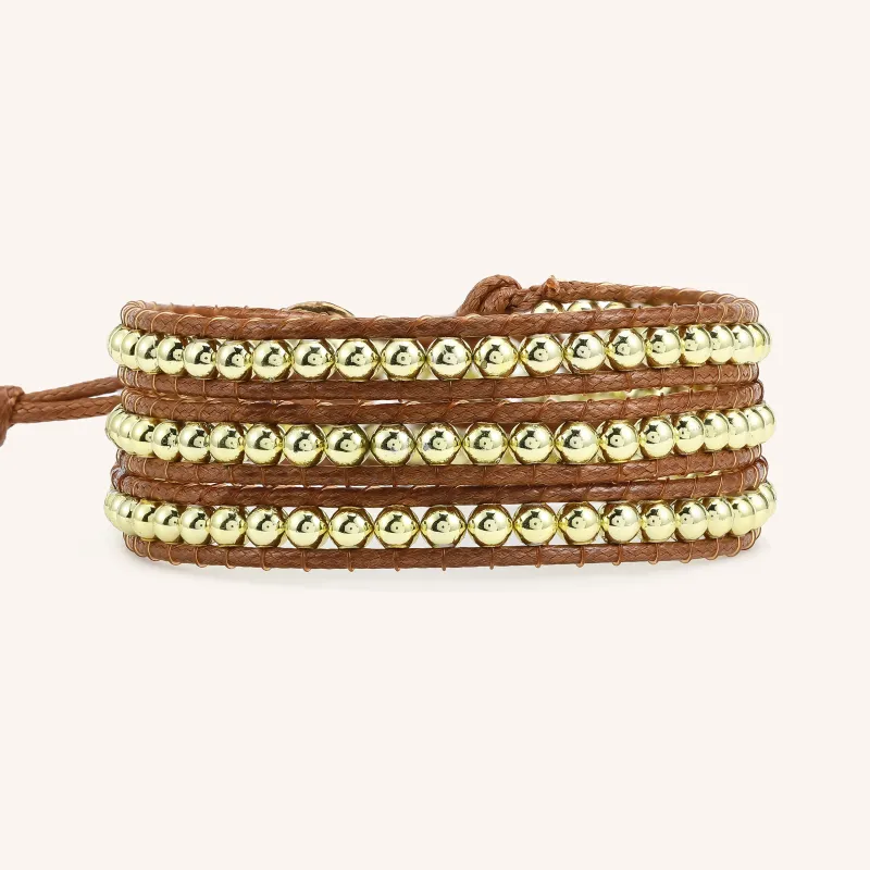 Gold Beads on Natural Leather Three Wrap Bracelet sold by Victoria Emerson