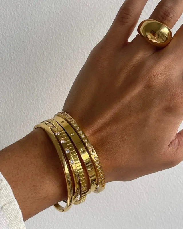 Gold Stainless Steel Bangles sold by Victoria Emerson