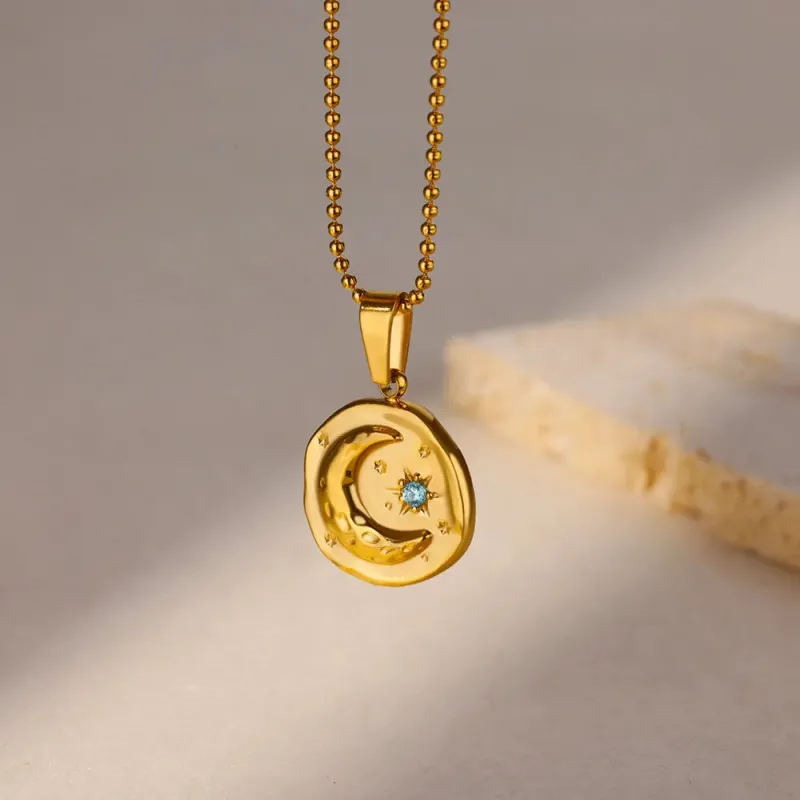 Blue Zircon Star & Moon Necklace made by Victoria Emerson