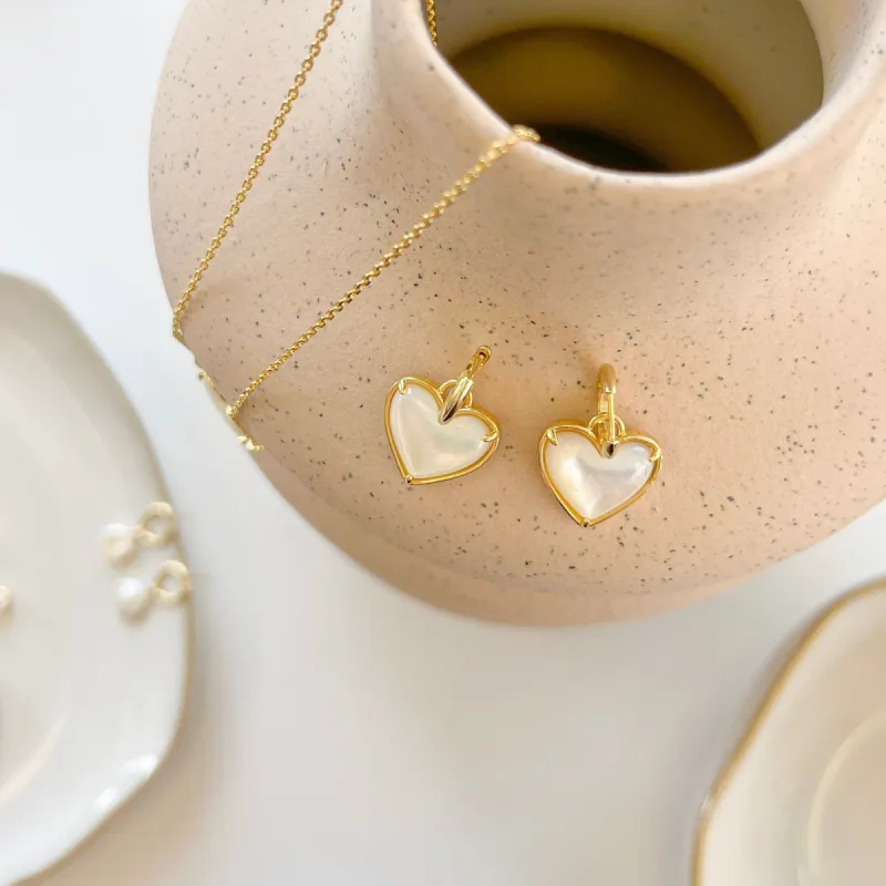 Mother Of Pearl Heart Huggies sold by Victoria Emerson
