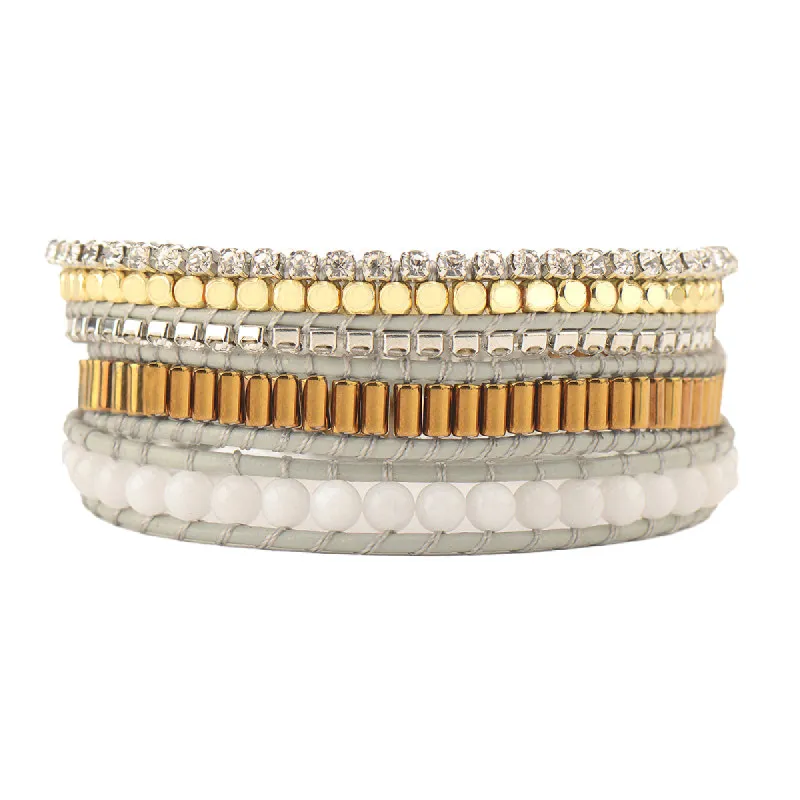 Crystals and Gold Beads with Ivory Stones on Gray sold by Victoria Emerson