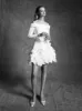 VRM361 - MINI FEATHERED AIRY FLOWER DRESS sold by Viktor & Rolf