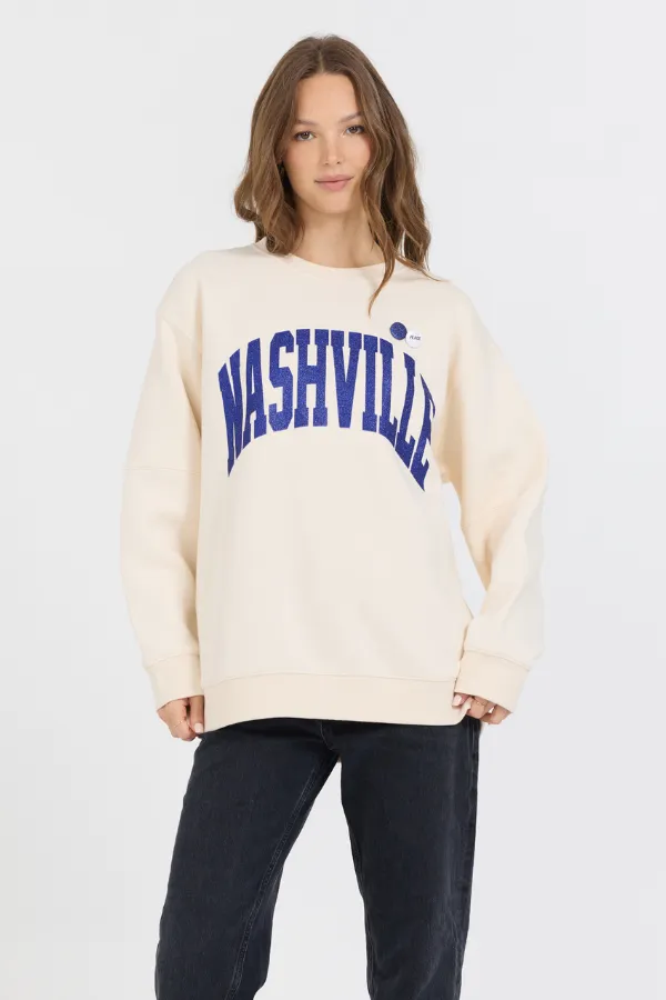 Cream W/ Royal Blue Garment Dye Fleece Crew W/ Glitter Print sold by Vintage Havana