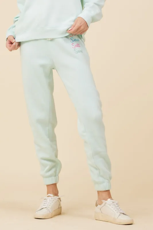 Light Aqua w/ Multicolor Burnout Fleece Embroidered Jogger sold by Vintage Havana