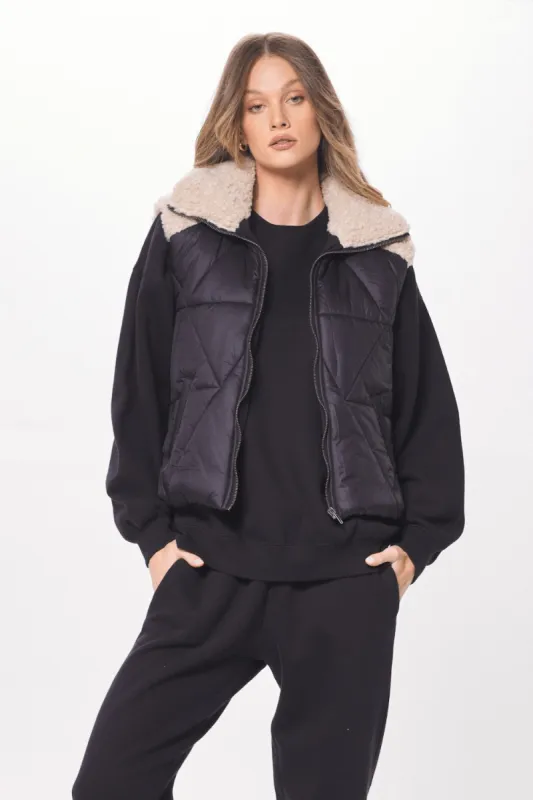 Black & Cream Mixed Media Puffer Shearling Vest sold by Vintage Havana