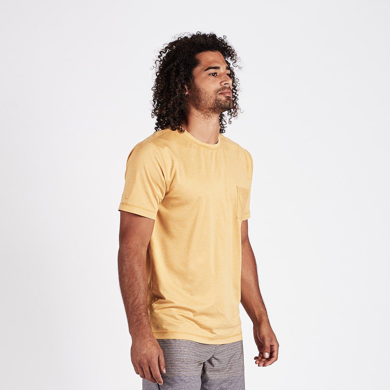 Tradewind Performance Tee | Saffron Heather sold by Vuori