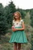 Poinsettia Dress: Spruce sold by Well Dressed Wolf