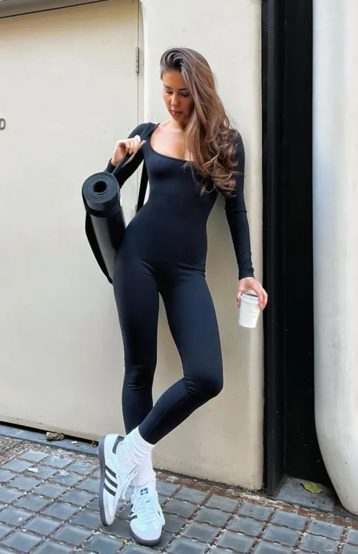 In A Daze Long Sleeve Jumpsuit Black sold by White Fox Boutique