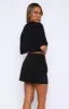 Keep Me Waiting Mini Skirt Black sold by White Fox Boutique