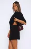 Keep Me Waiting Mini Skirt Black sold by White Fox Boutique