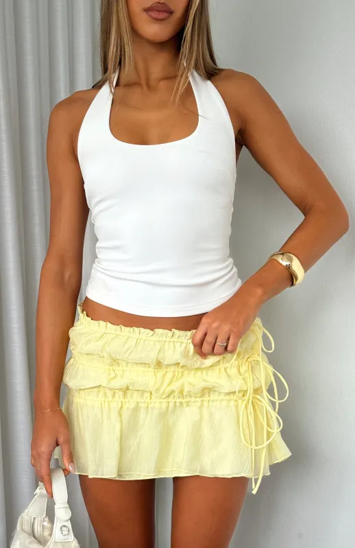 Free Falling Tiered Mini Skirt Lemon sold by White Fox Boutique