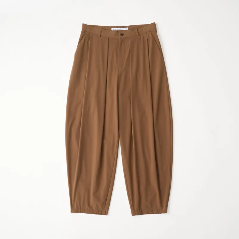 8 TUCK WIDE TAPERED PANTS sold by White Mountaineering
