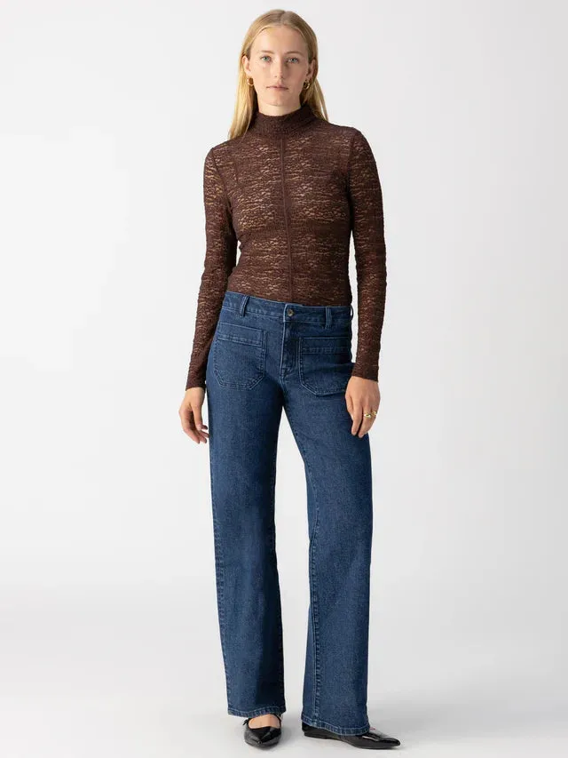 LONG SLEEVED TEXTURED MOCK NECK TOP sold by Wildflower