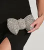 Looks So Divine Rhinestone Bow Minaudiere Clutch sold by Windsor