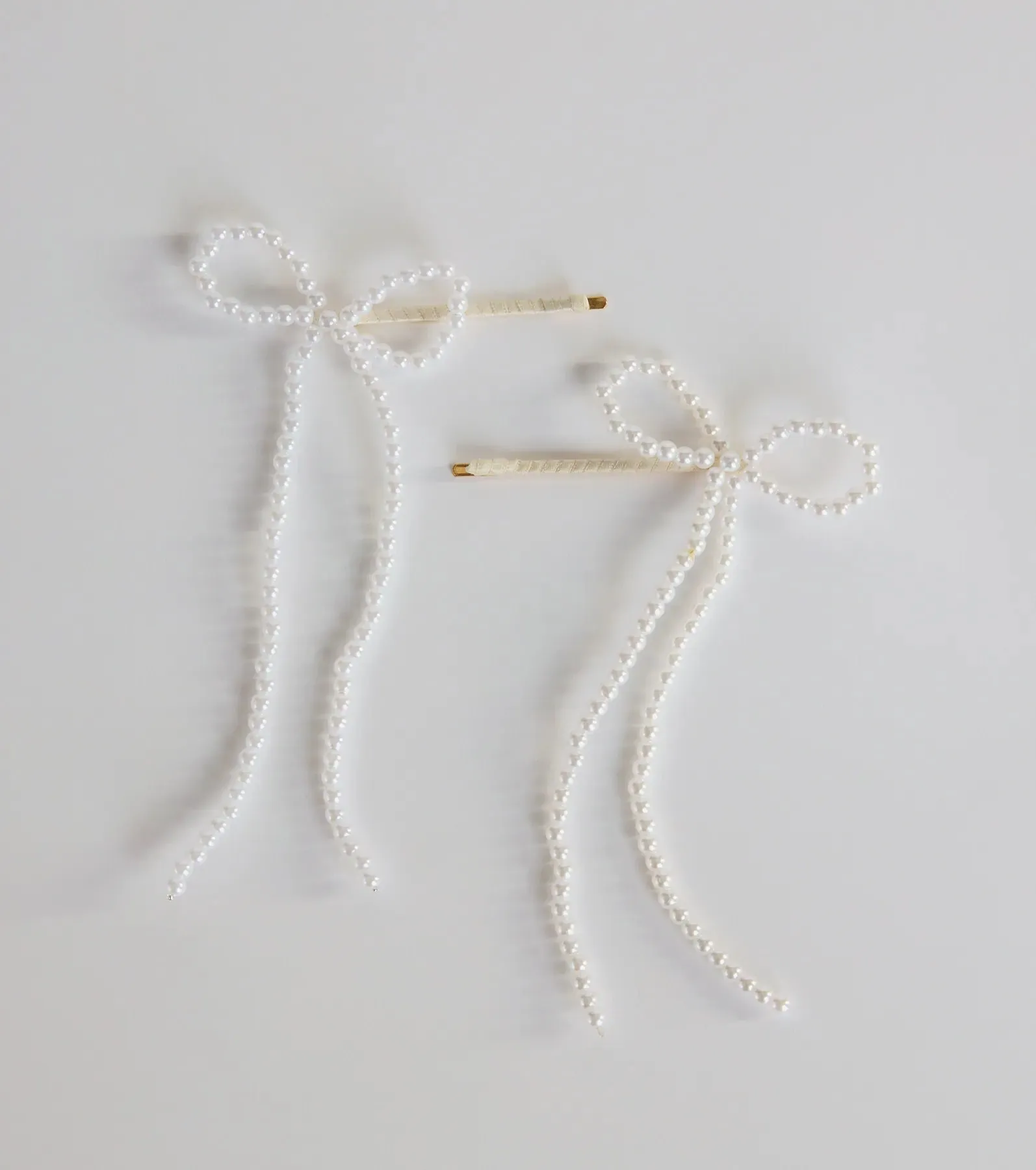 Captivating In Two Pack Faux Pearl Hair Bow Bobby Pins sold by Windsor