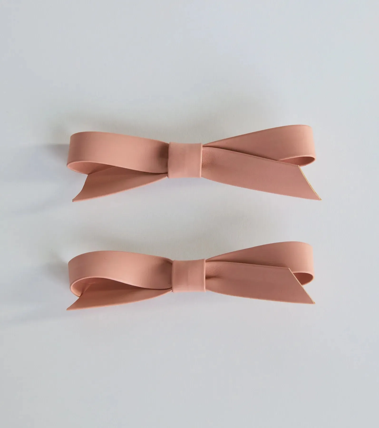 Charmed Finish Faux Leather Bow Hair Clip Set sold by Windsor