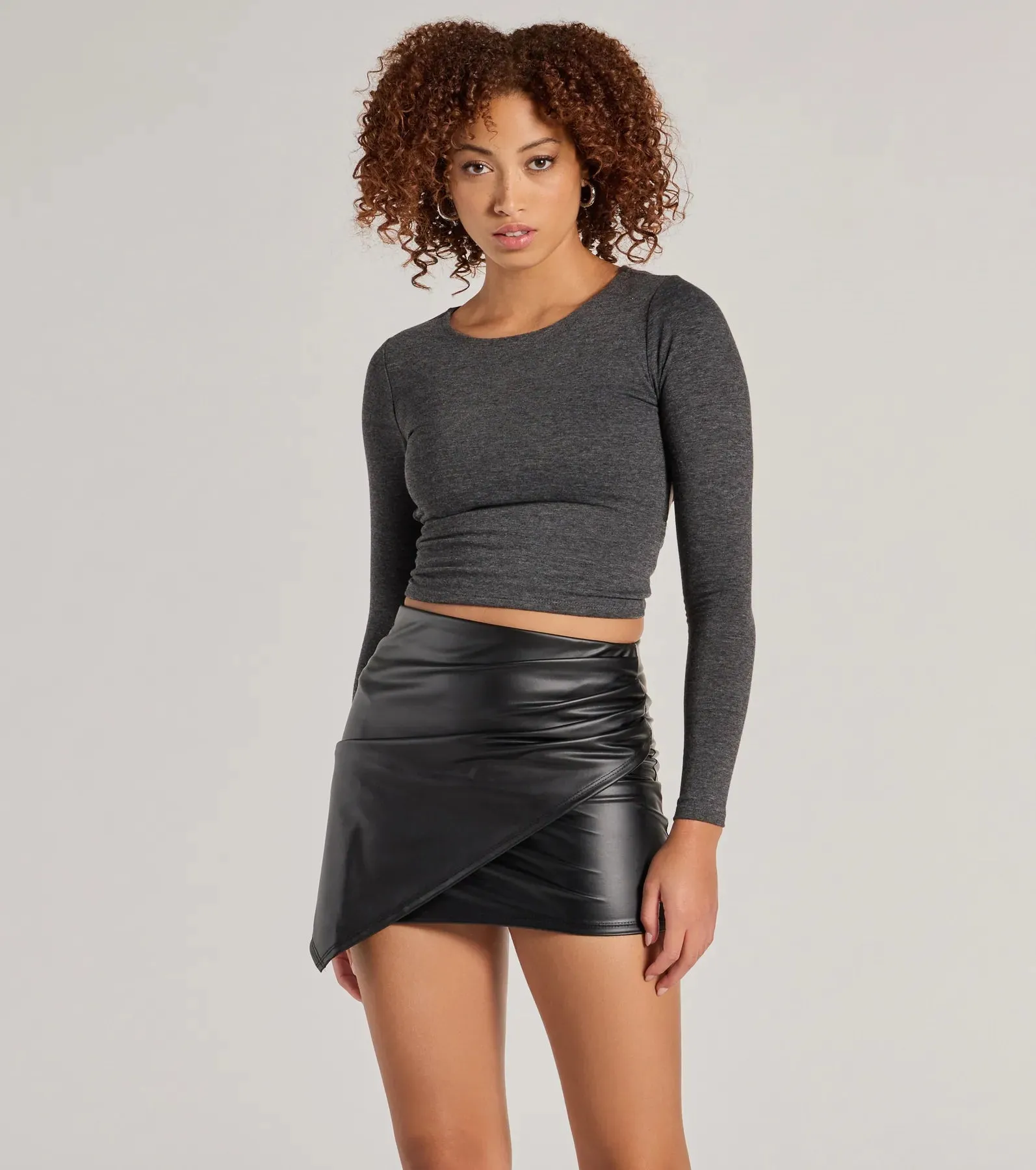 Raise the Bar Faux Leather Wrap Mini Skirt sold by Windsor
