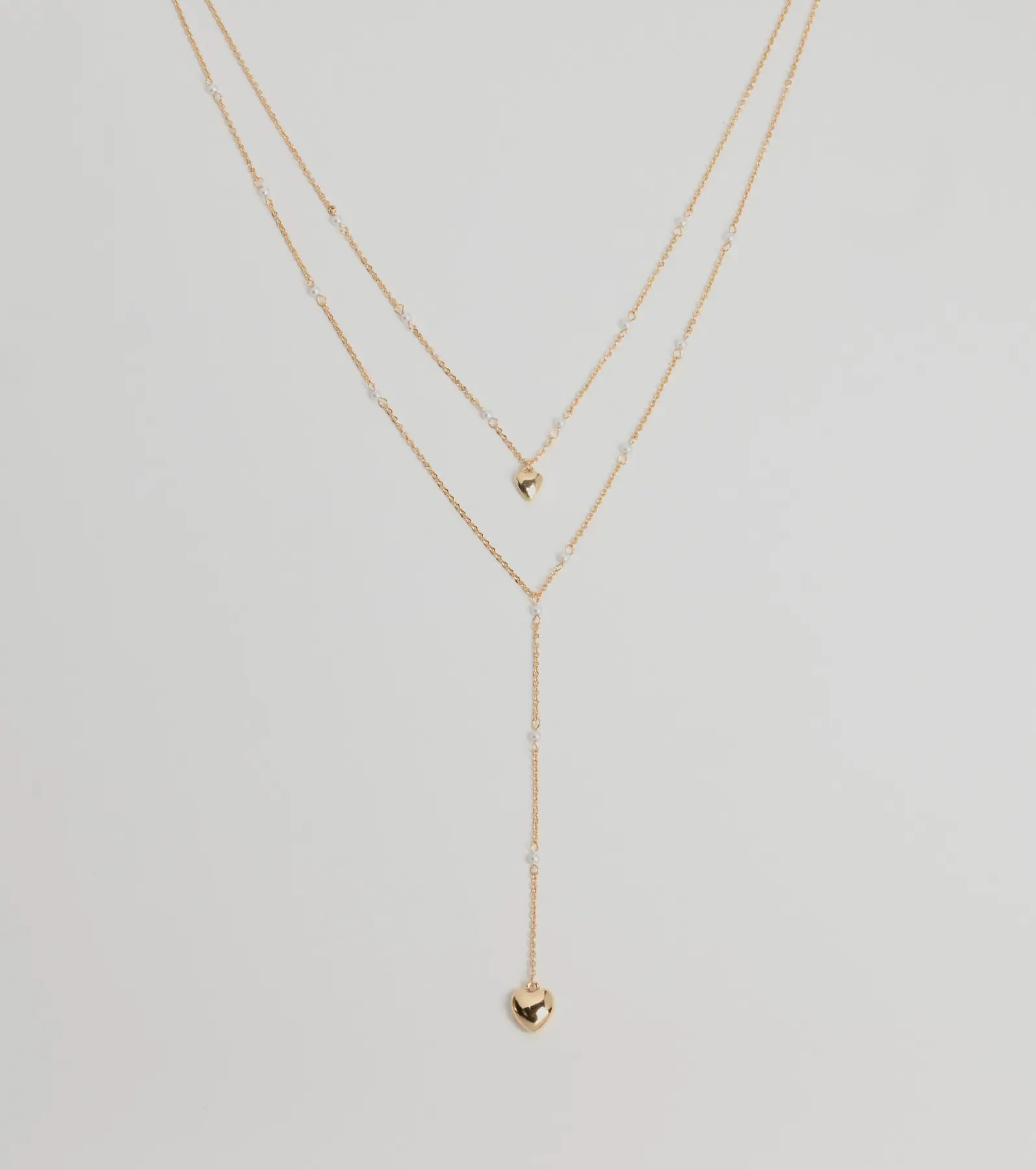 Sweet Glam Layered Faux Pearl And Heart Pendant Necklace sold by Windsor