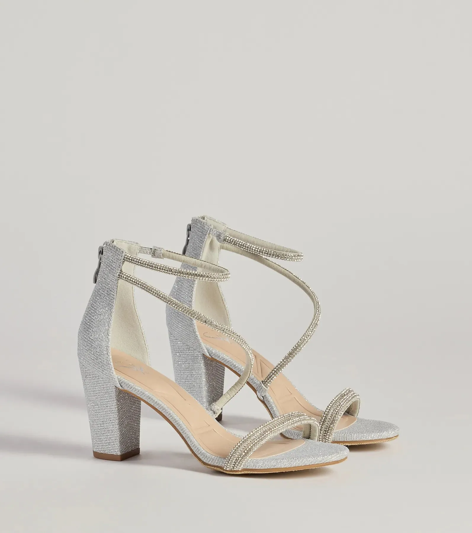 Reigning In Rhinestone Asymmetrical Strap Glitter Heels sold by Windsor