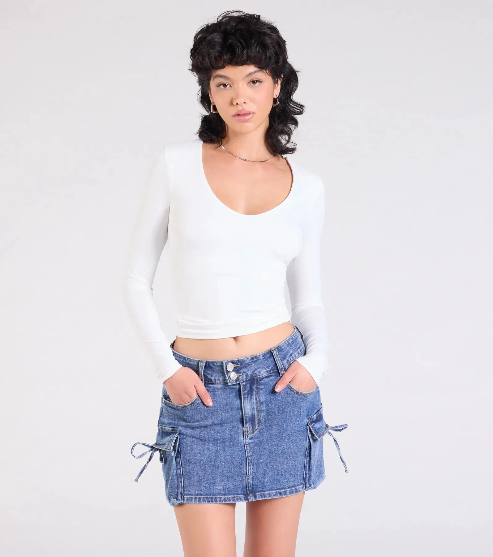 A Vibe Mid-Rise Cargo Denim Mini Skirt sold by Windsor