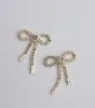 Elegant Charm Bow Stud Earrings sold by Windsor